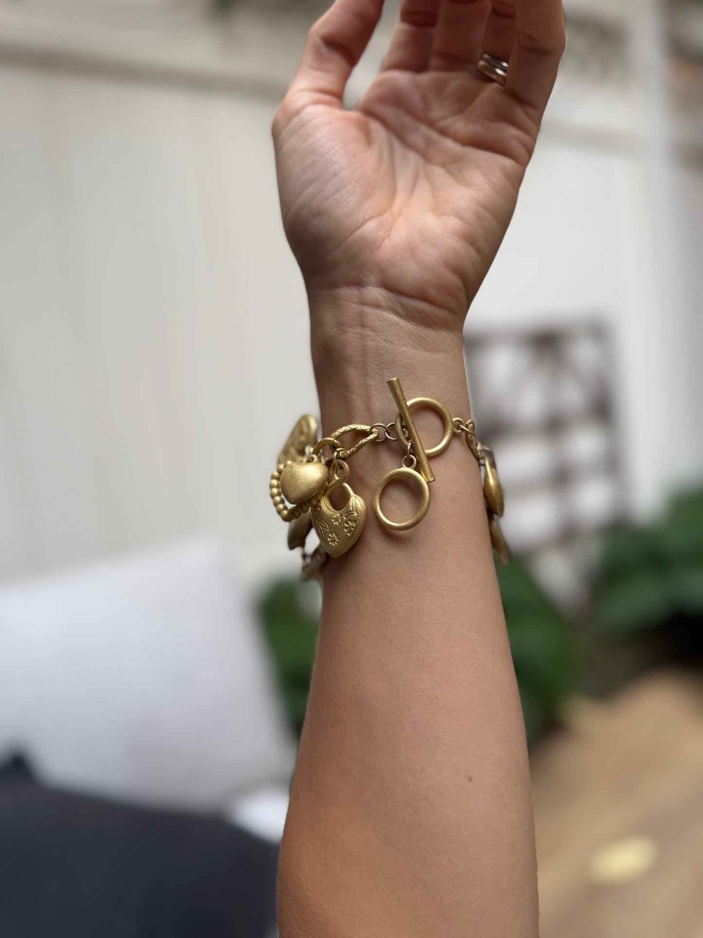 Vintage gold tone hearts charm bracelet
