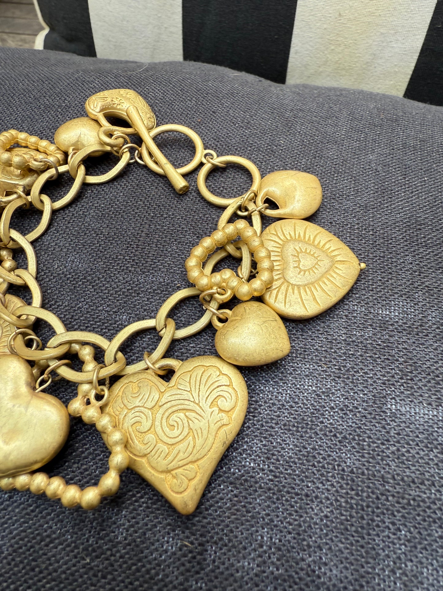 Vintage gold tone hearts charm bracelet