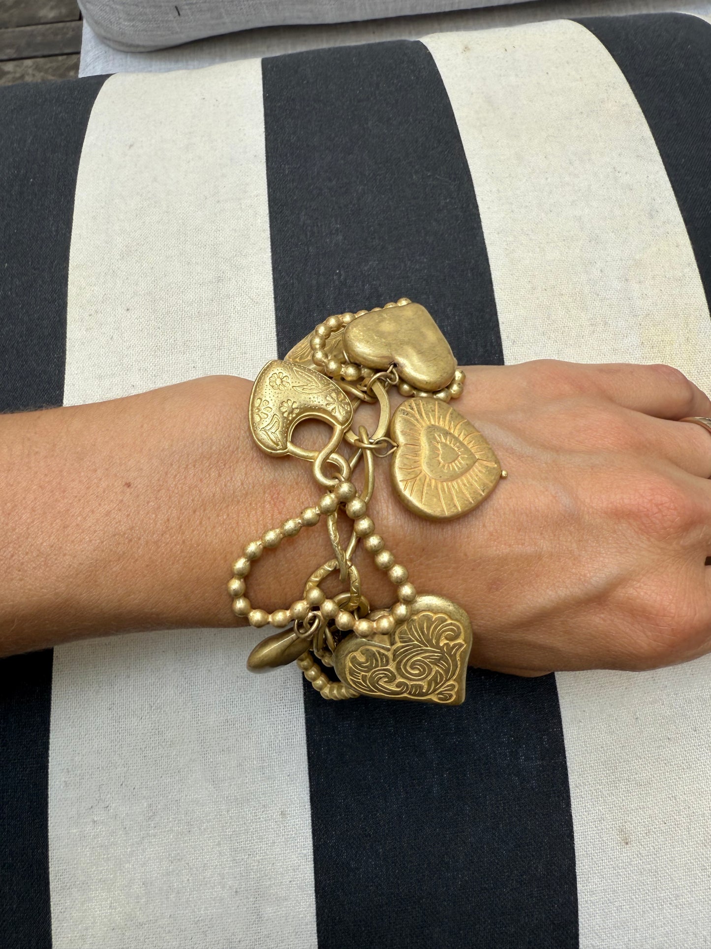 Vintage gold tone hearts charm bracelet