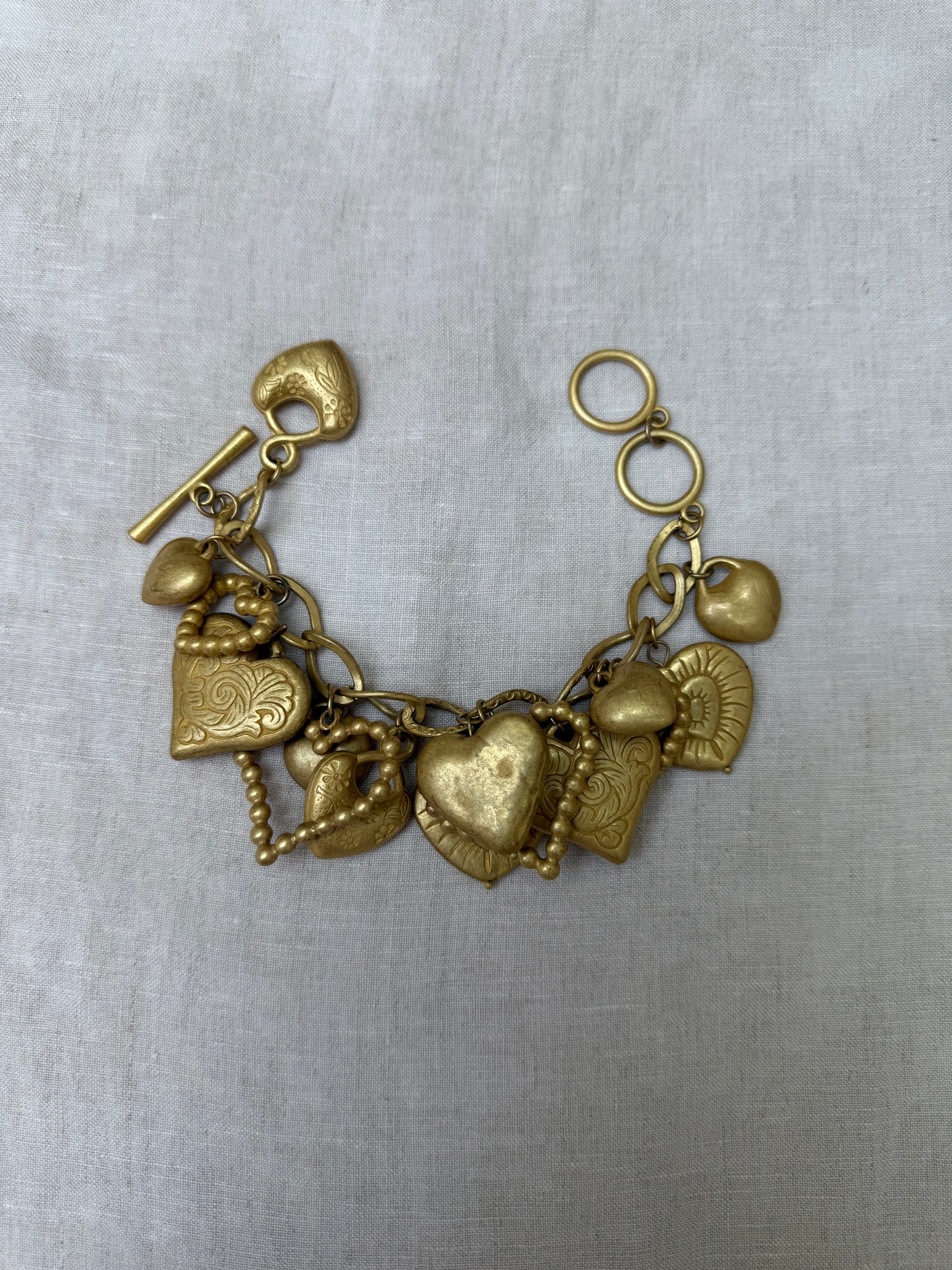 Vintage gold tone hearts charm bracelet