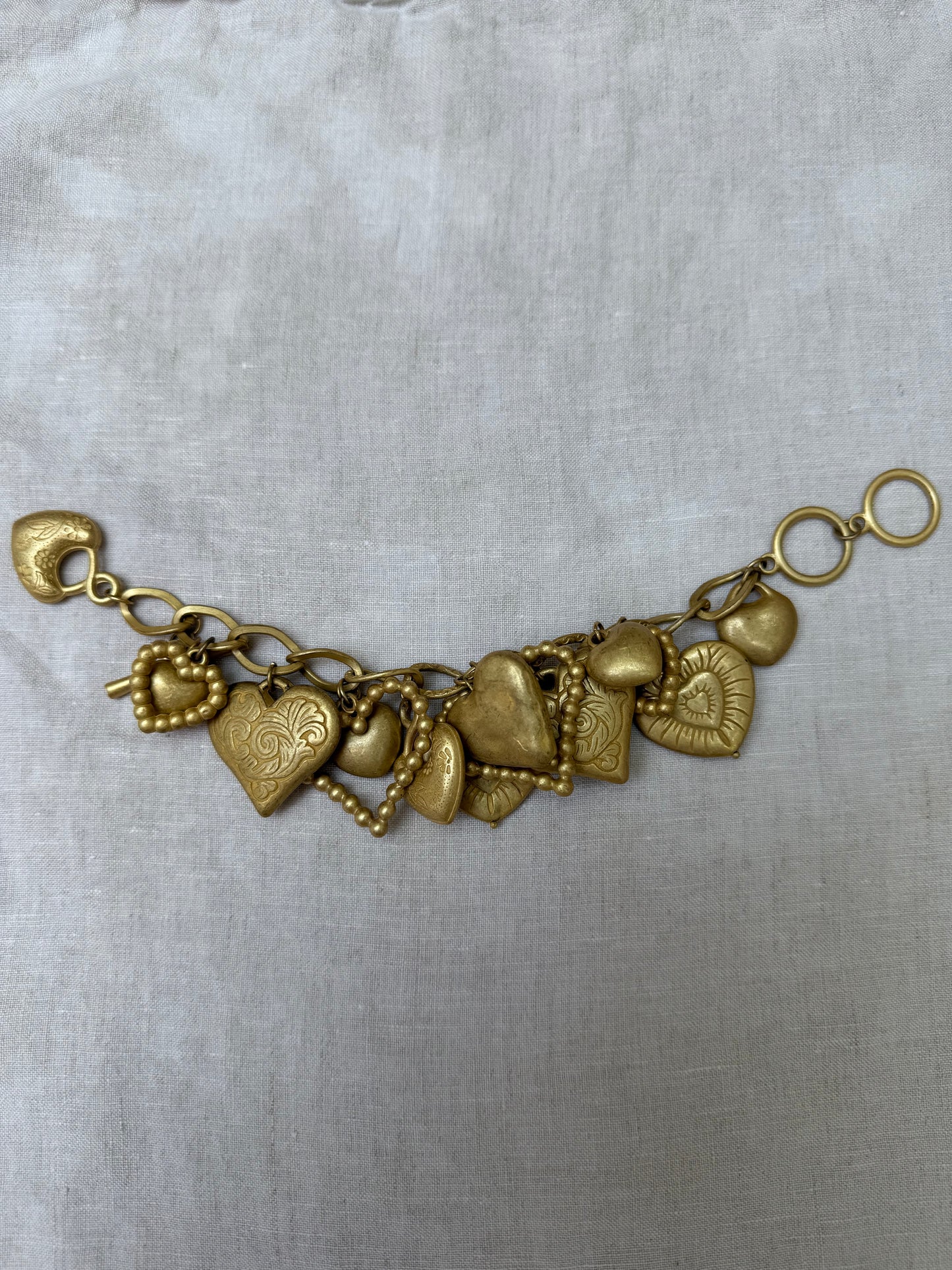 Vintage gold tone hearts charm bracelet