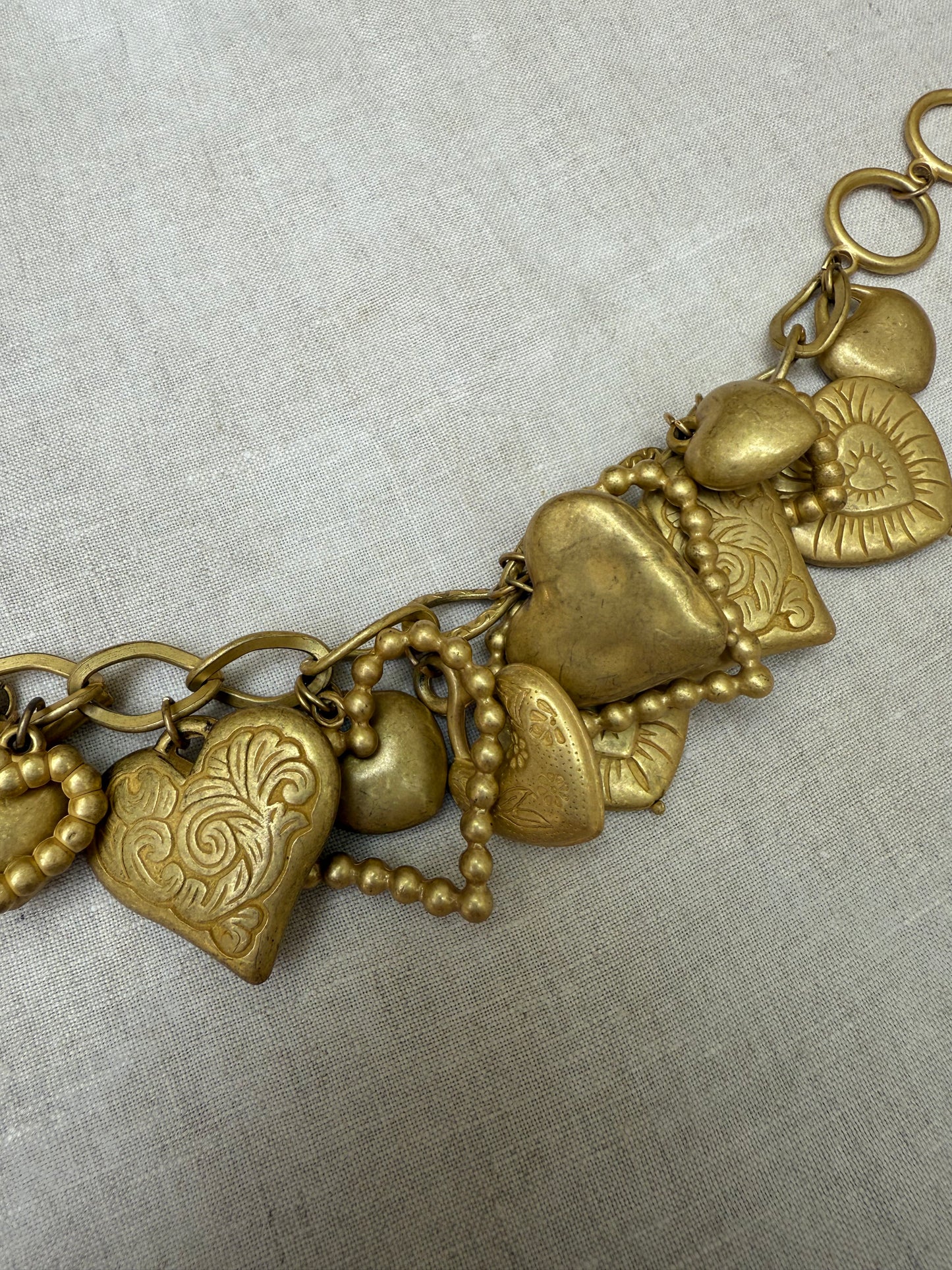 Vintage gold tone hearts charm bracelet