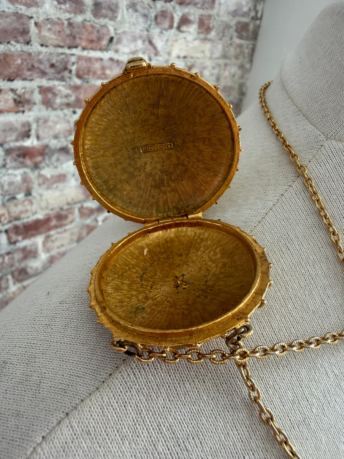 80s Estée Lauder solid perfume locket necklace with  blue lapis lazuli-style stone